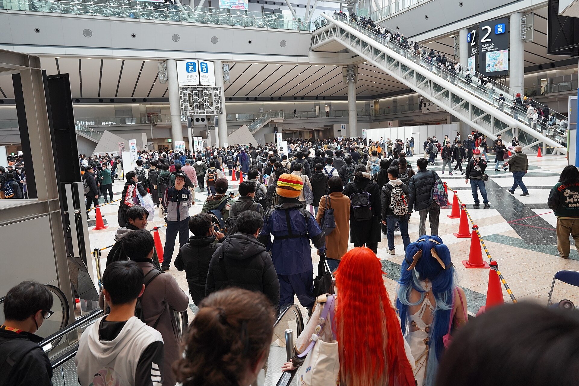 Visitors gather in the West Hall atrium at Winter Comiket C107, 30 December 2025.