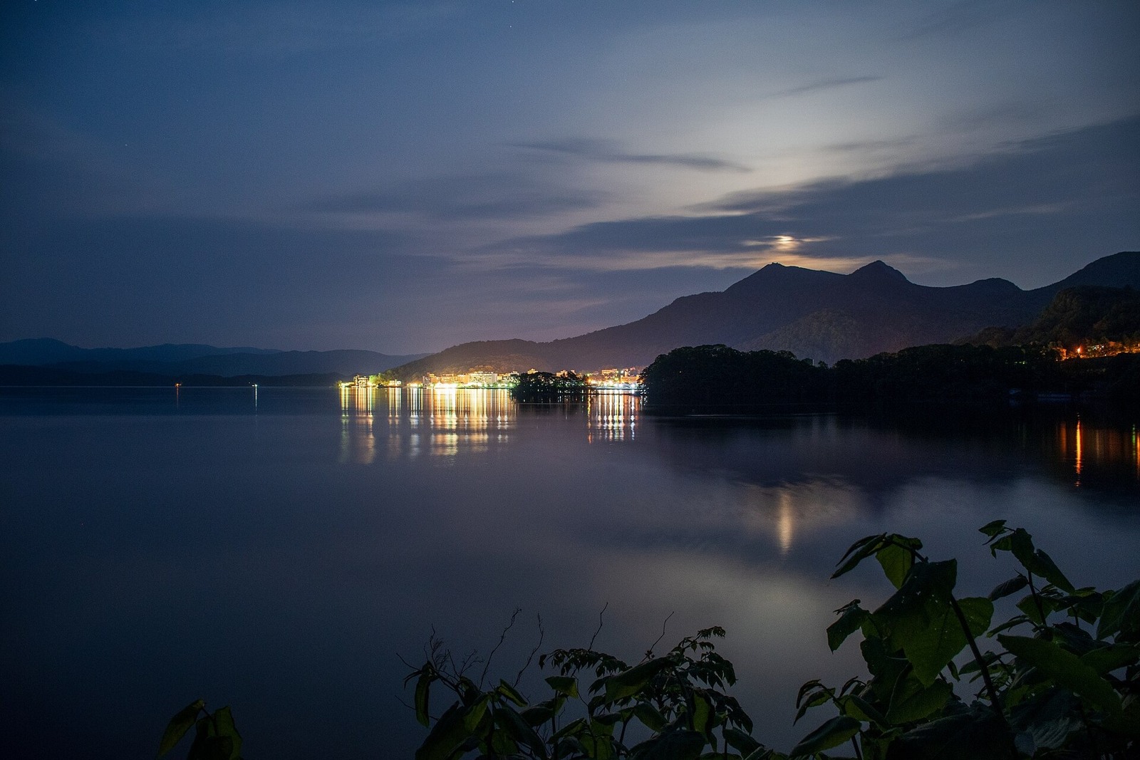 Lights beside Lake Toya after dark in May.