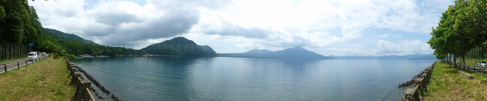 Lake Shikotsu and its mountain backdrop in August.