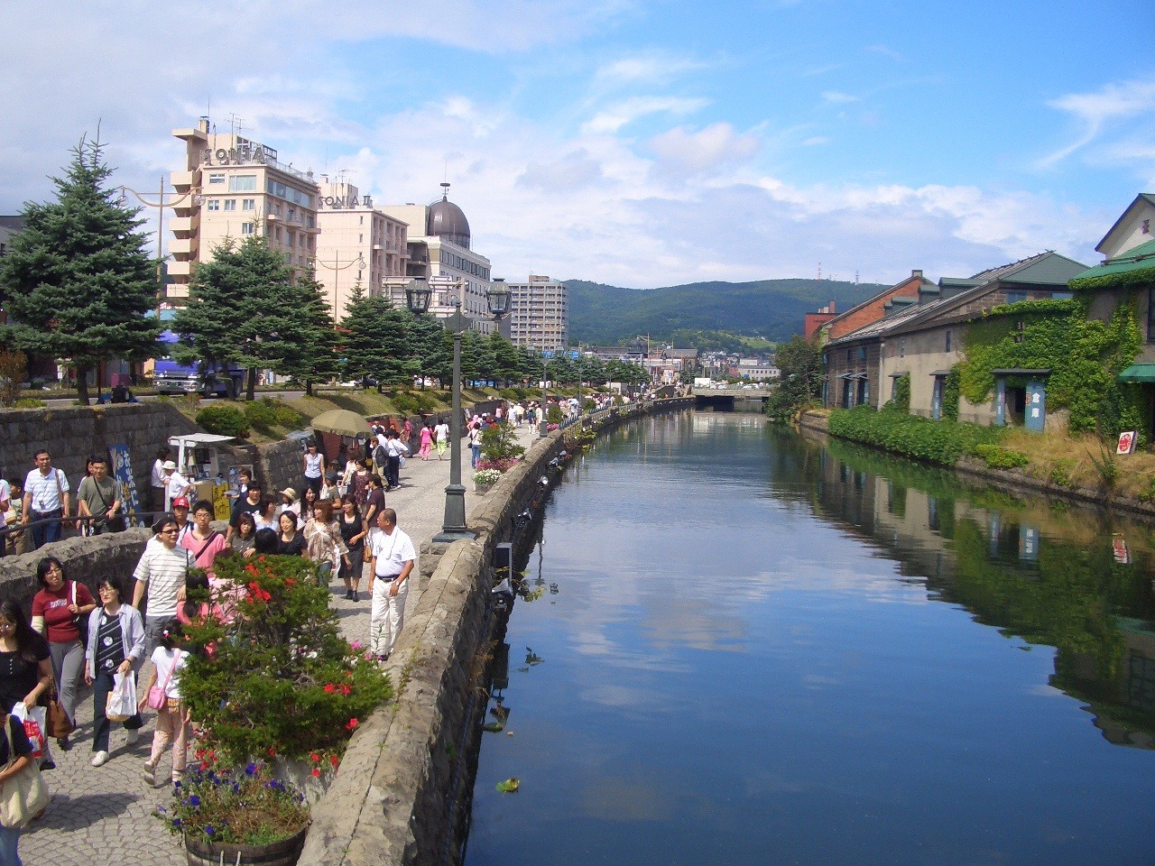 The canal promenade and former warehouses in summer.