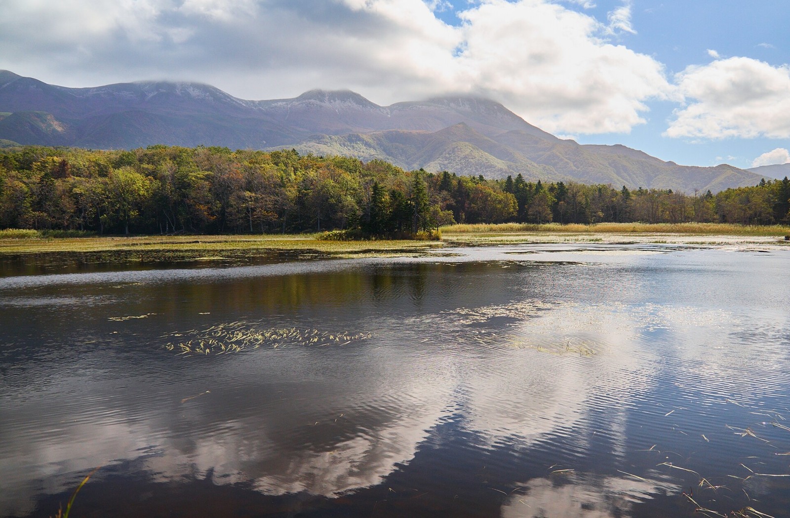 Mountains reflected in the water at Shiretoko Five Lakes.