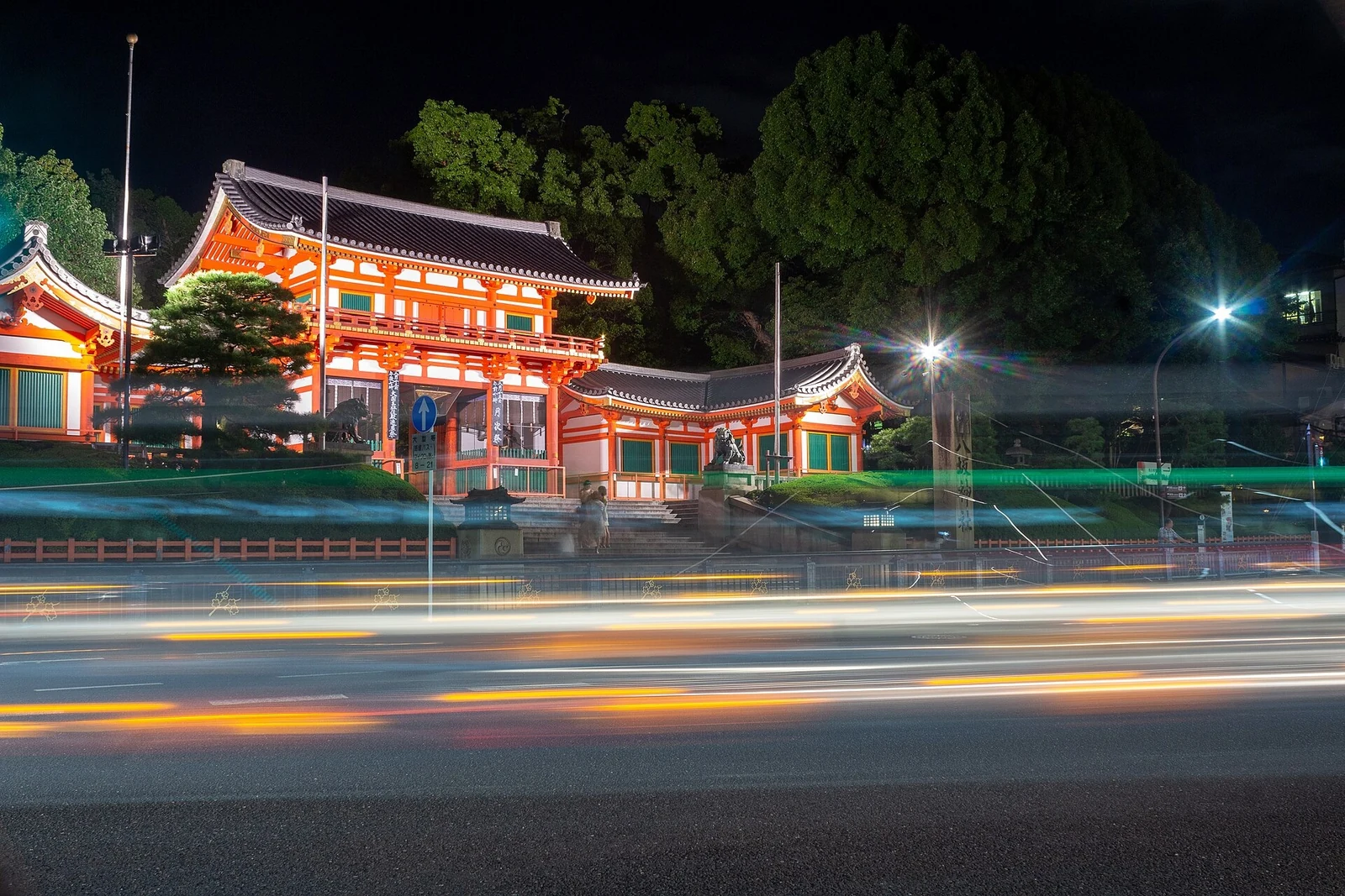 Yasaka Shrine’s western gate illuminated at night.