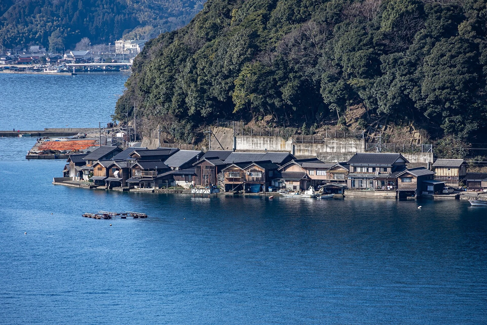 Funaya boathouses follow the shoreline of Ine Bay.