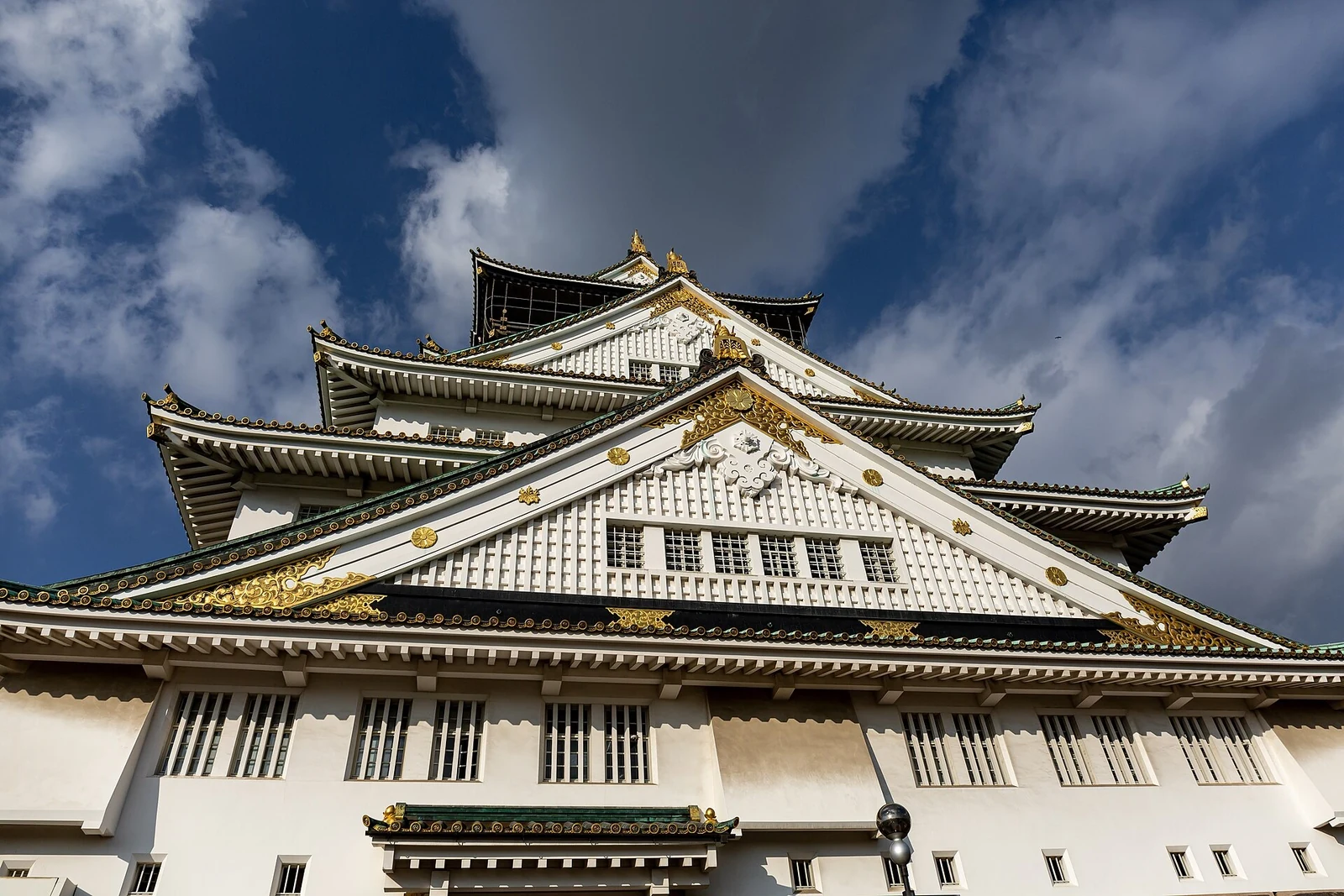 A closer view of the tower’s roofs and decorative details.