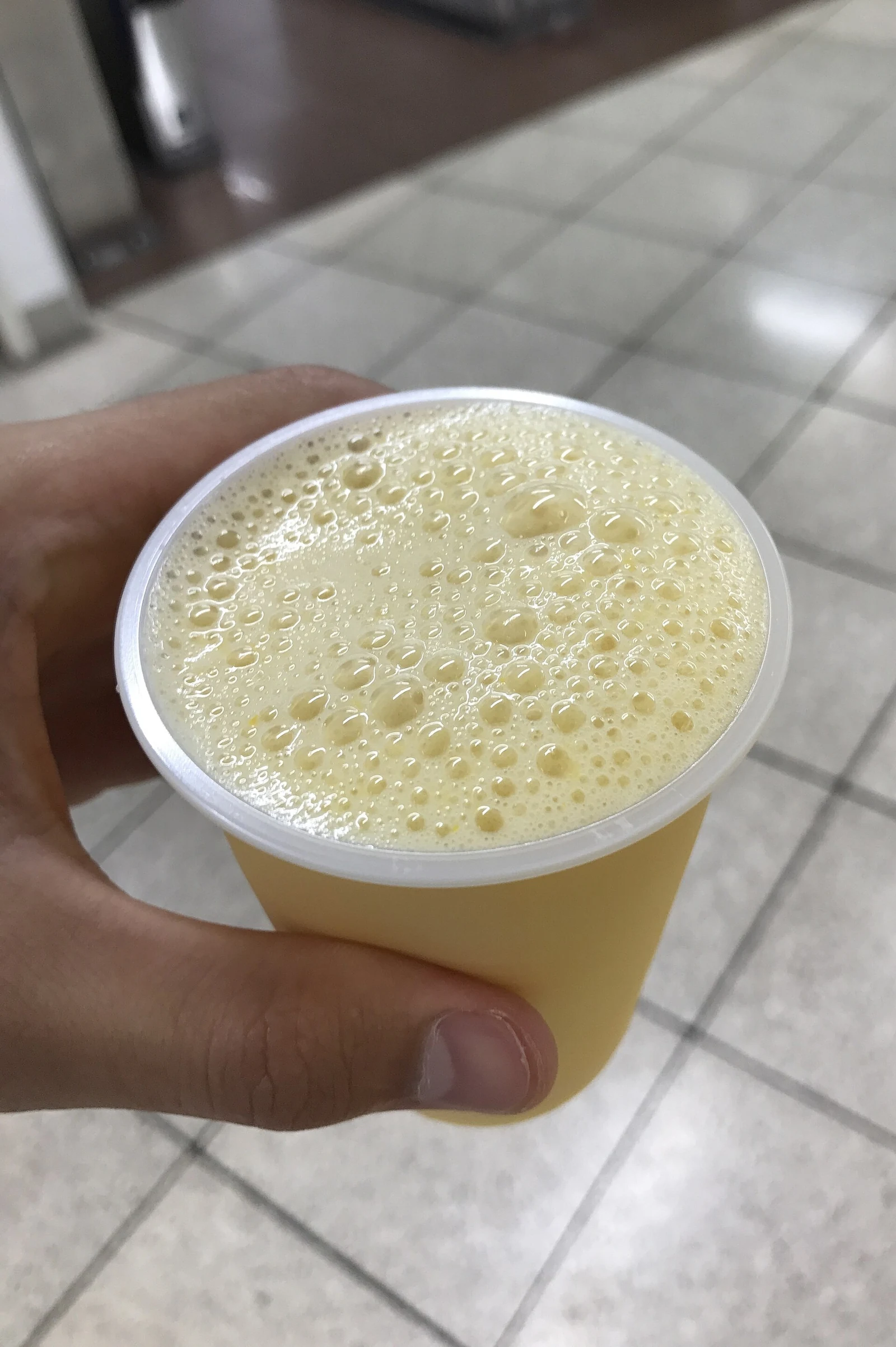 A cup of mixed juice photographed in Umeda in 2017.