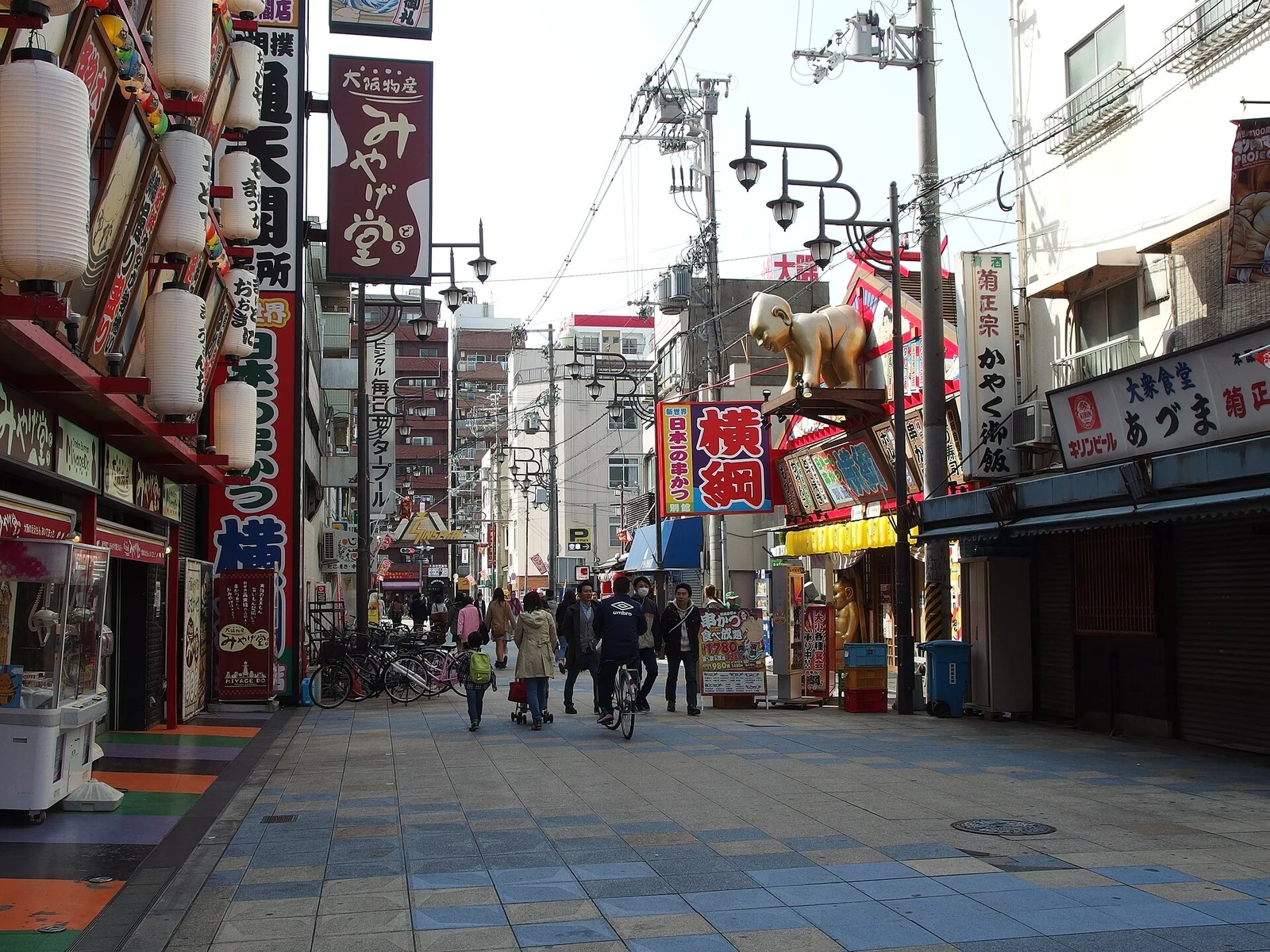 Restaurants and a pedestrian street beneath the tower in 2014.