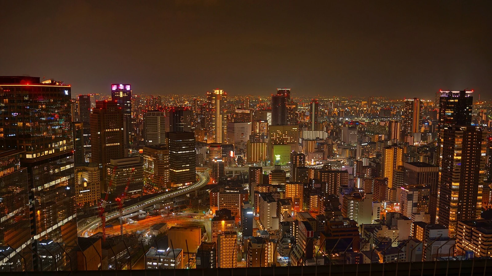 An evening city panorama from Umeda Sky Building in 2025.