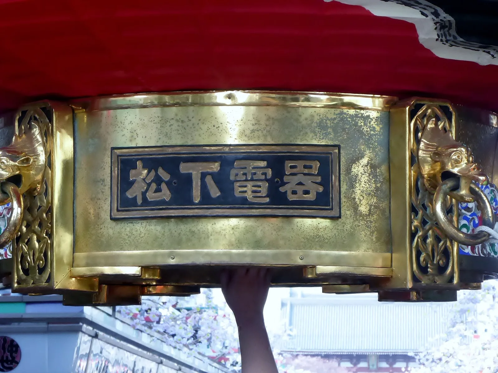 A close view of the base of Kaminarimon's giant red lantern.