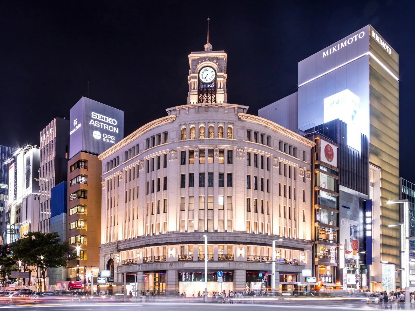 Wako's clock tower illuminated after dark in Ginza.