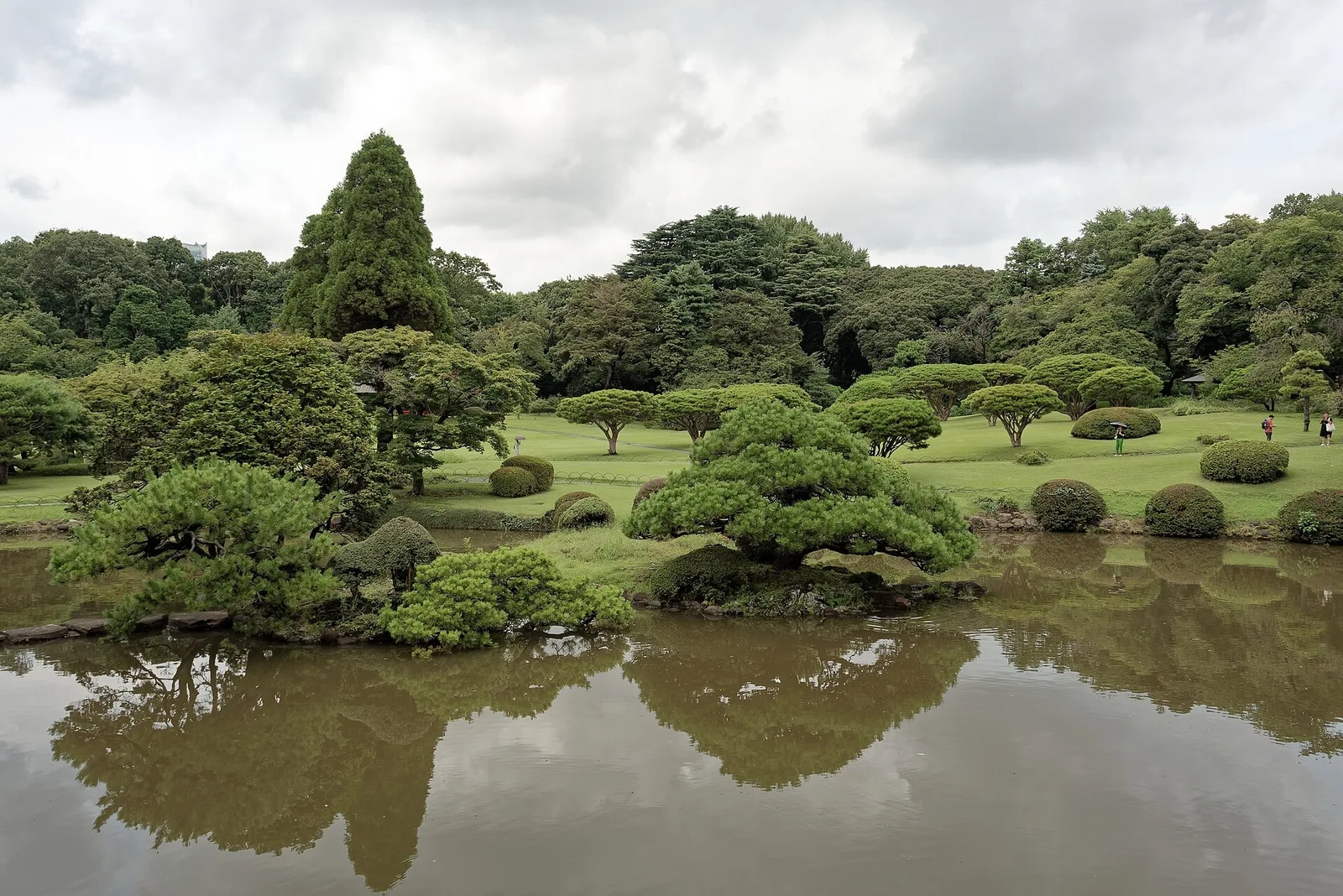 A landscaped pond in Shinjuku Gyoen's Japanese garden in summer.